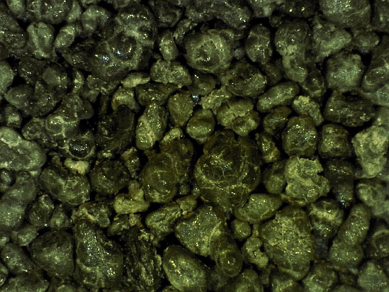 Glauconite. Glauconite forms in shallow, low-oxygen marine environments when there is little or no sedimentation taking place. Glauconite is considered a diagnostic mineral for continental shelf environments. Grains of glauconite