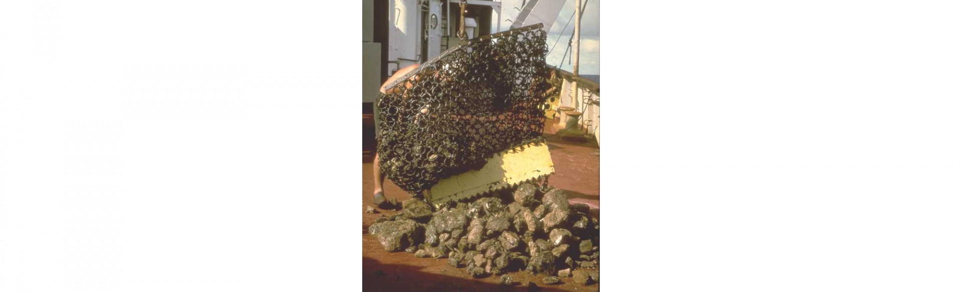 A dredge basket being emptied on the deck of the Research Vessel Vema.